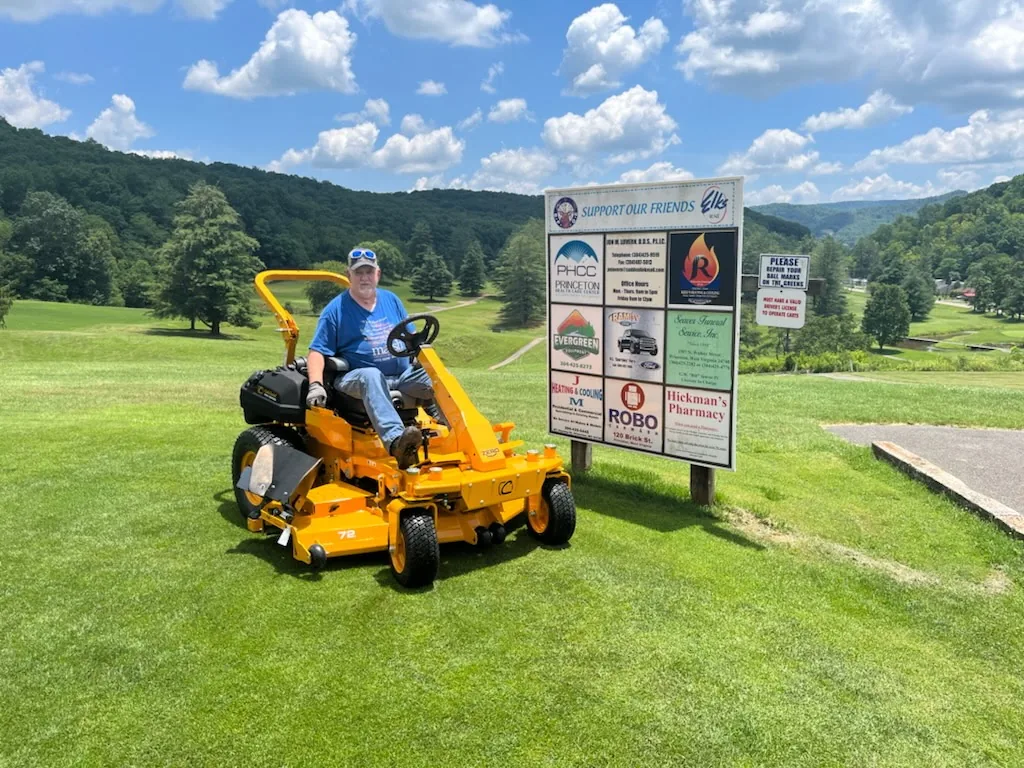 Evergreen customer seated on a Cub Cadet commercial mower