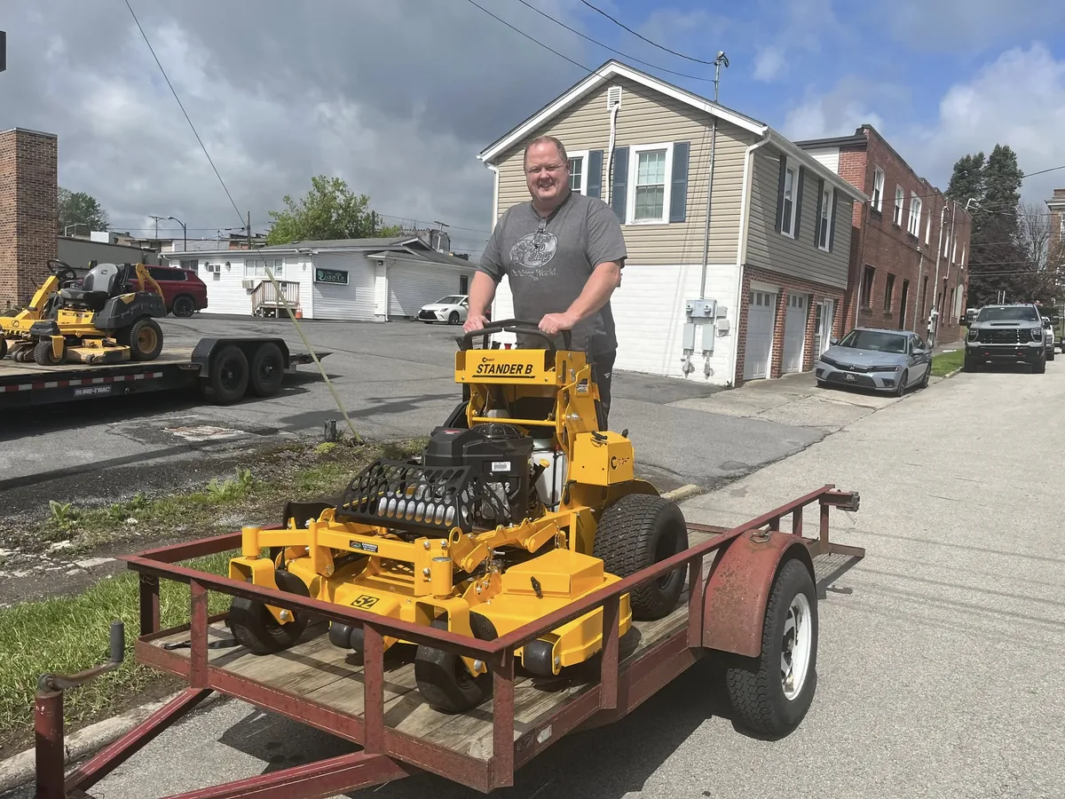 Evergreen customer with a Wright Stander B mower on a trailer
