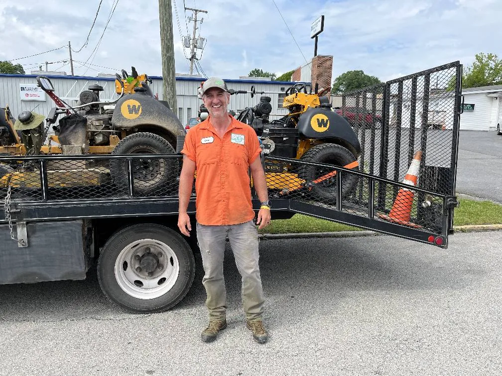 Evergreen customer with Wright commercial mowers loaded on a trailer